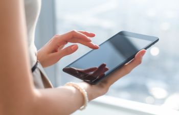 Woman Using a Tablet Device