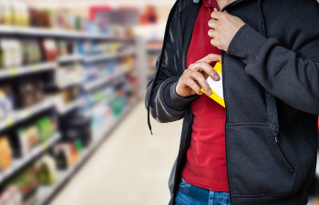 retail shoplifting man stealing in supermarket theft at shop